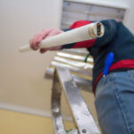 Electrician,Man,Worker,In,Uniform,Installing,Ceiling,Fluorescent,Lamp