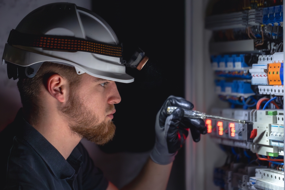 A,Male,Electrician,Works,In,A,Switchboard,In,Overalls,Against